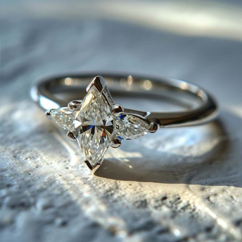 Marquise Cut Diamond Engagement Ring with Pear-Shaped Side Stones.